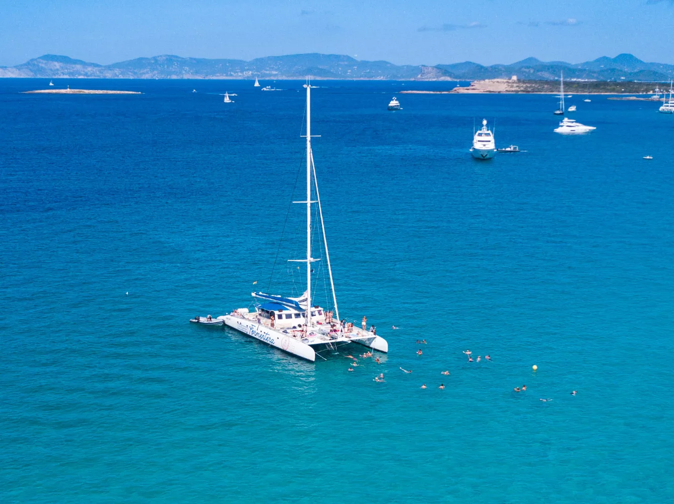 Aerial view of the SunCat sailing between Ibiza and Formentera