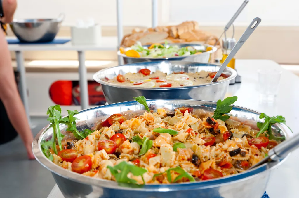 Salads and barbecue served on board